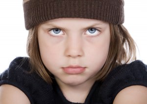 bigstockphoto_Shot_Of_A_Cute_But_Grumpy_Chil_5735352