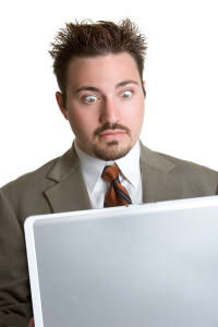 image of surprised man with laptop