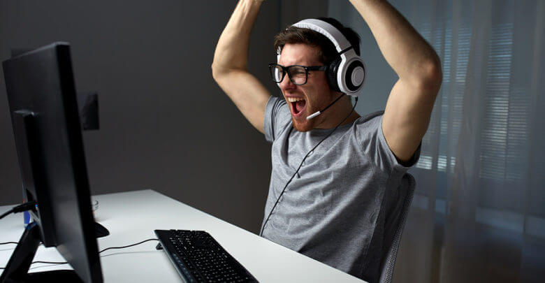 Man celebrating at desk