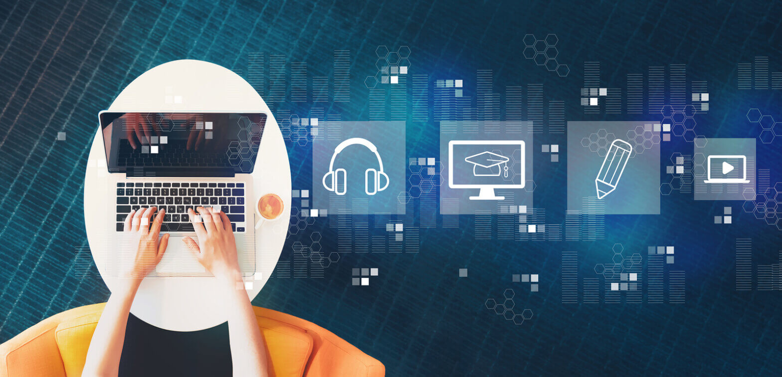 Person typing on a laptop at a round white table with a cup of coffee, overlaid with learning- and tech-icons in blue.