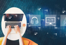 Person typing on a laptop at a round white table with a cup of coffee, overlaid with learning- and tech-icons in blue.